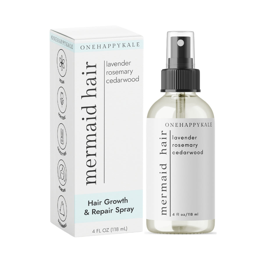 A bottle of Mermaid Hair Growth & Repair Spray by One Happy Kale with a spray nozzle, next to its packaging box.